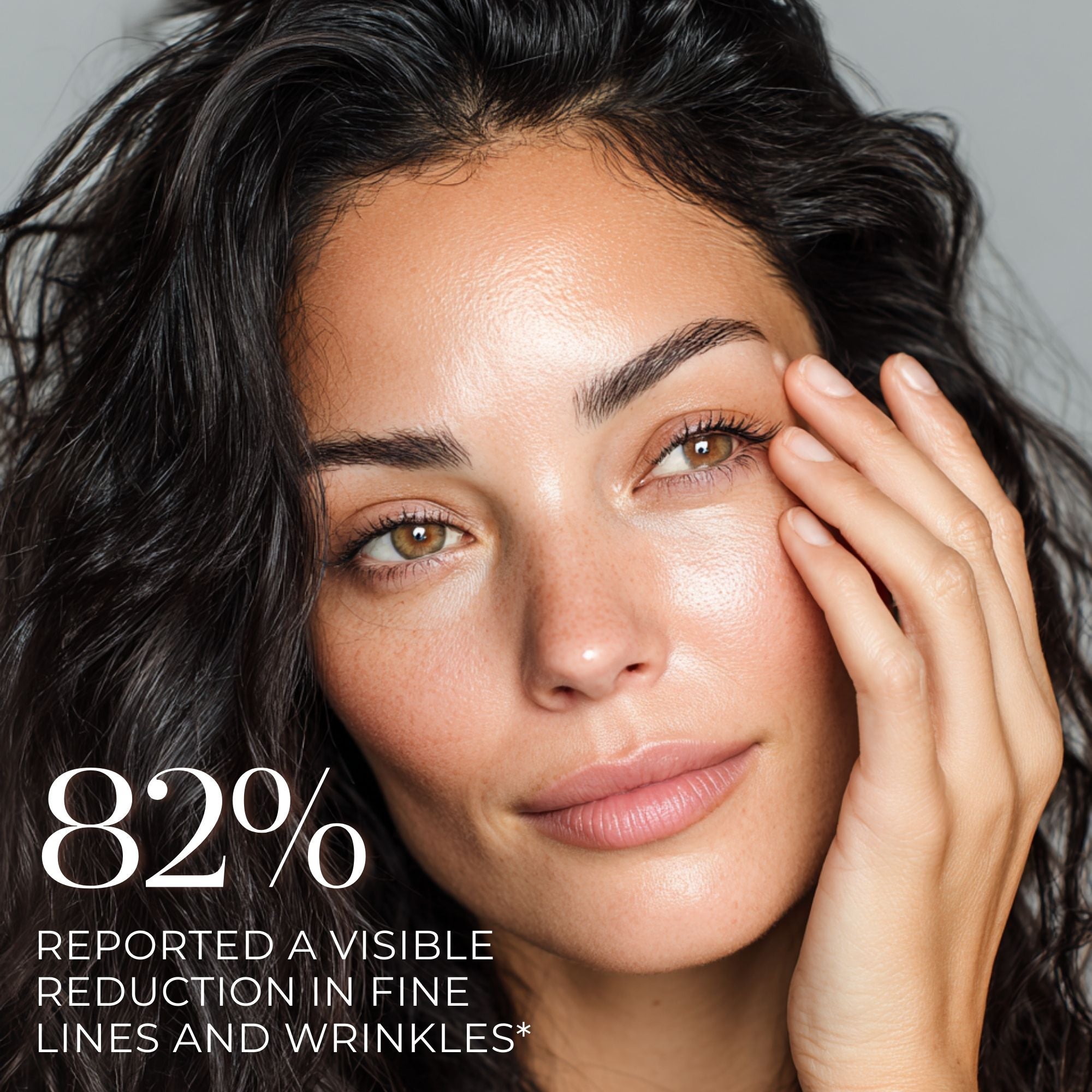 Woman with one hand on her face, showing a skincare product effect, with text about visible reduction in fine lines and wrinkles.