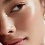 Close-up of a person's eye with a soft focus on the skin texture.